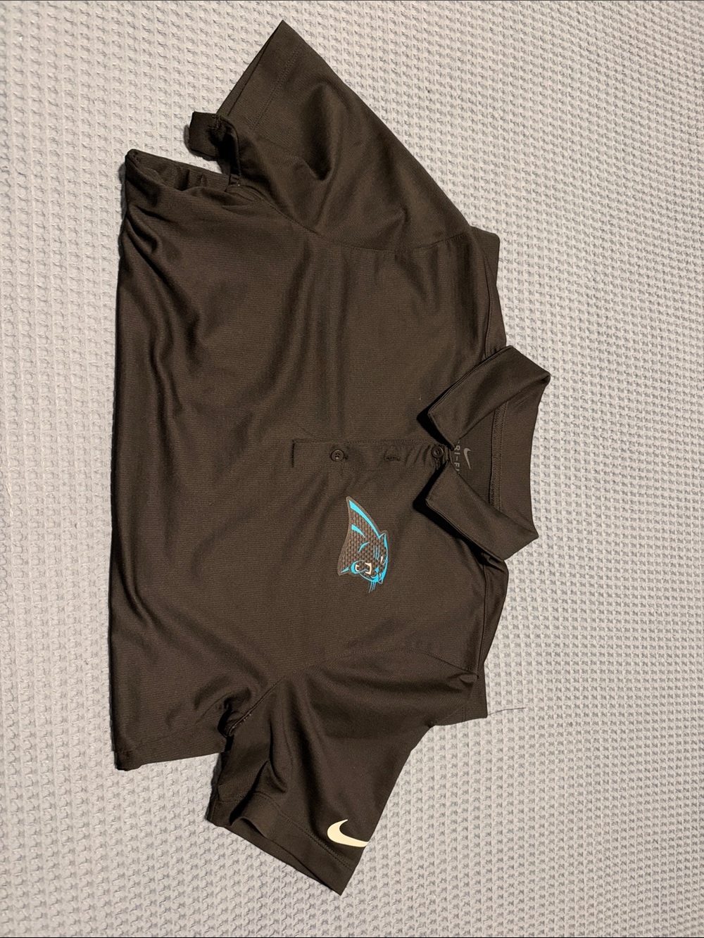 Nike Men’s Dark Brown Polo with Teal Carolina Panthers Logo